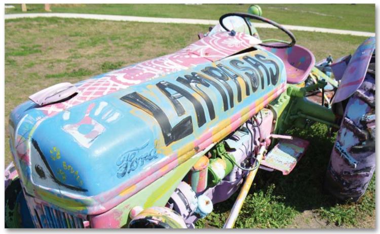 Sculpture garden a good place for a walk After rain moved through the area this week, sunny skies returned and brought moderate winter temperatures, just right for a brisk walk outside. A stroll through the Hanna Springs Sculpture Garden shows this brightly painted tractor bearing the city’s name. MONIQUE BRAND | DISPATCH RECORD