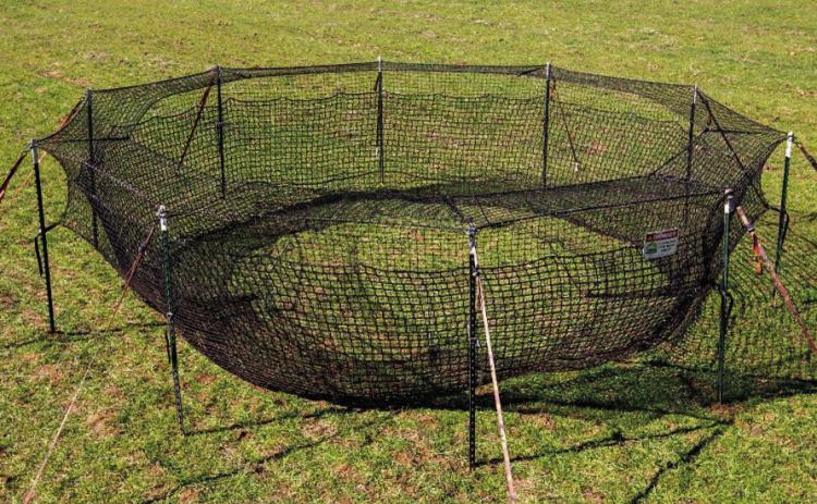 Paul Holland with the Hill Country Soil &amp; Water Conservation District says the hog traps are easy to set up and simple to operate. Landowners simply need to supply bait corn to lure wild pigs into the trap. The trap system may be leased for up to 60 days. COURTESY PHOTO
