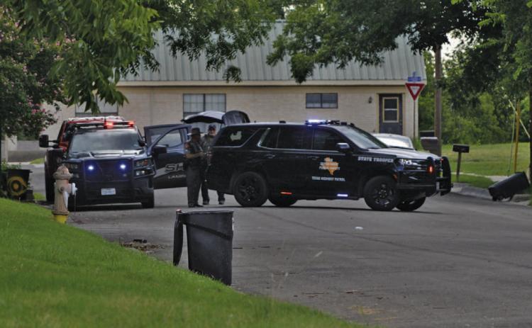 Texas Department of Public Safety vehicles park on West Avenue A near Arnold Street during a standoff with a perpetrator responsible for shooting two Lampasas women, then later himself, on Thursday. ERICK MITCHELL | DISPATCH RECORD
