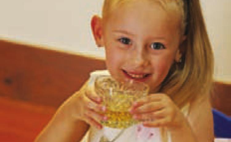 Five-year-old Reagan Groves sips her apple juice “tea” while she enjoys socializing at the Teddy Bear Tea. JOYCESARAH MCCABE | DISPATCH RECORD