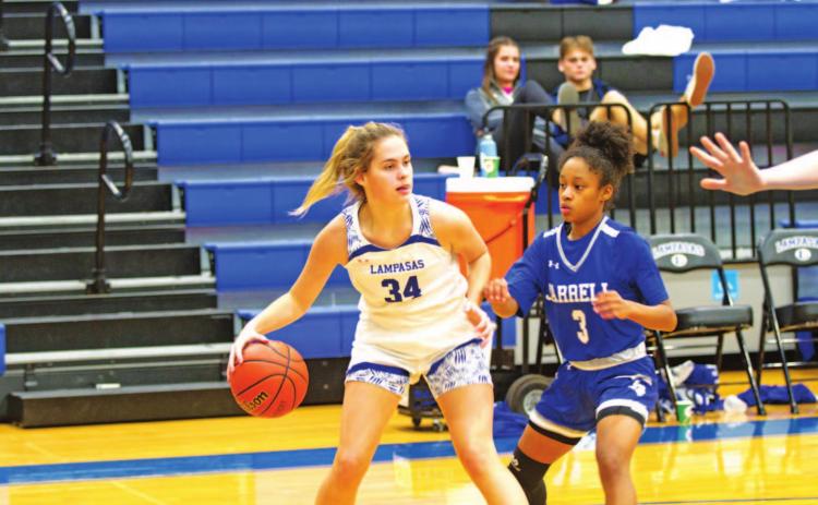 Jamie Ball dribbles and looks for a teammate during a previous game against Jarrell. HUNTER KING | DISPATCH RECORD