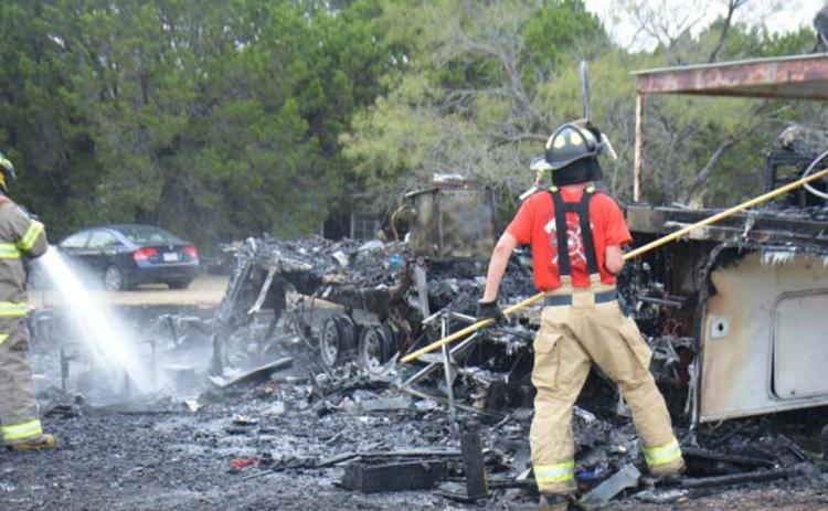 Members of the Kempner Volunteer Fire Department cleared out a camper that was engulfed in flames for close to 30 minutes Tuesday afternoon. No injuries were reported. MONIQUE BRAND | DISPATCH RECORD