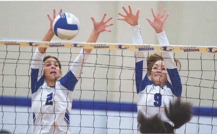 Landry White, left, and Lilee Hamill execute a block against Waco Connally. HUNTER KING | DISPATCH RECORD