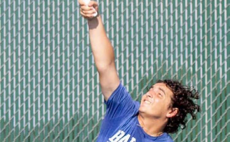 Josiah Copeland won his singles match against Ingram, 7-5, 6-1, helping the Badgers hold off the Warriors’ comeback. ANA SOFIA MEYER | DISPATCH RECORD
