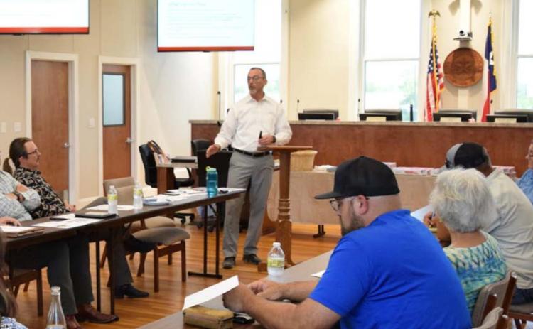 Lampasas City Manager Finley deGraffenried, center, speaks about the capital improvement projects budget at a special City Council workshop. ALEXANDRIA RANDOLPH | DISPATCH RECORD