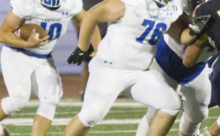 Caden Melton, right, blocks during the Badgers’ undefeated regular season in 2020. FILE PHOTO