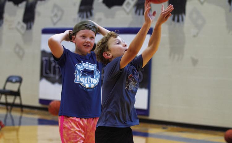 HUNTER KING | DISPATCH RECORD Ayson Nuckles shoots at basketball camp.