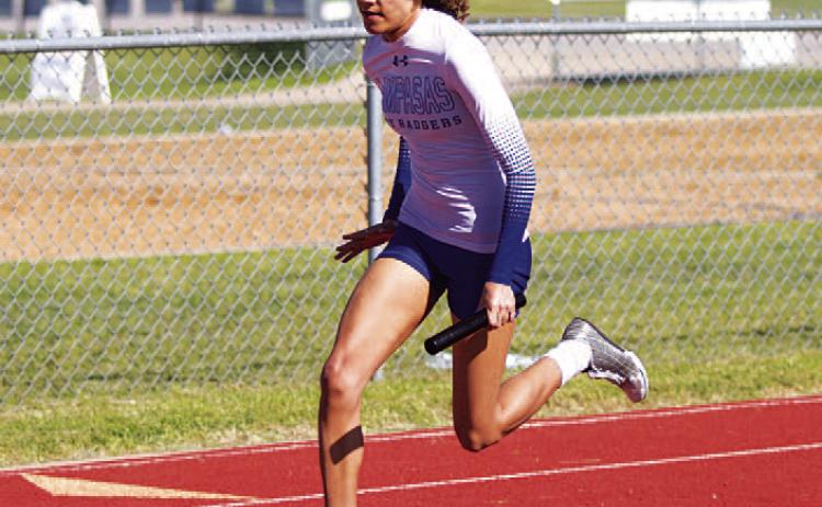 HUNTER KING | DISPATCH RECORD Aubrey Spellman competes in multiple relay races for the Lady Badgers.