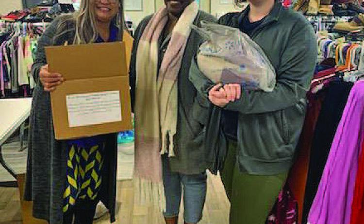JoAnn Mensch, at left, Shavonne McClendon and Lilian Stephen pause for a photo inside the New Beginning of Restoration Beginning and Hope location. COURTESY PHOTO
