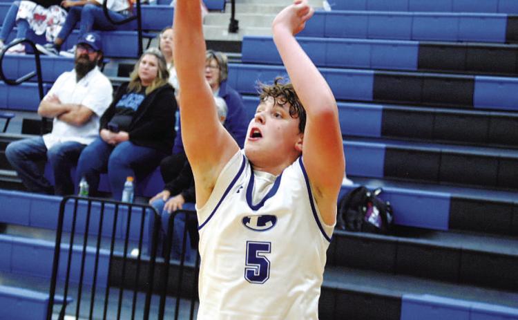 Aidan Nuckles lets fly one of his five successful threes in Tuesday’s game against Eastside Memorial. HUNTER KING | DISPATCH RECORD