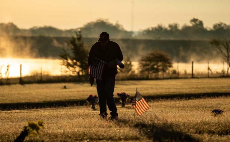 Memorial flags placed at cemetery