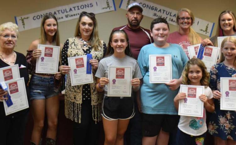 Division champions named at the County Fair include, back row from left, Bonnie Wales, Brandy Tower, Delores Tower, Gary Franklin, Katy Darden and Megan Caddies; and front row, Payton Crawford, Grant Gill, Anna Gray and Mattie McBeth. MONIQUE BRAND | DISPATCH RECORD