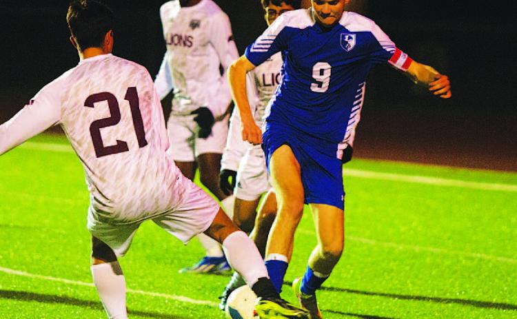 HUNTER KING | DISPATCH RECORD Keaton Black fights for possession of the ball against Brownwood in the Badgers’ district opener.