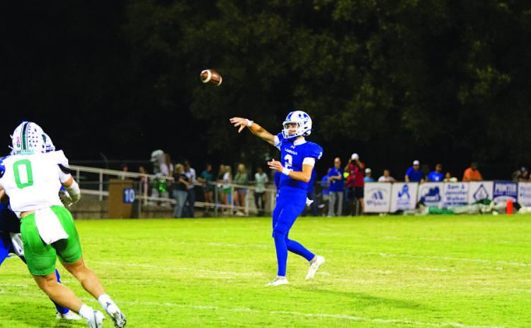 Bryson Roberts tosses a pass over the middle during the game against Burnet. HUNTER KING | DISPATCH RECORD