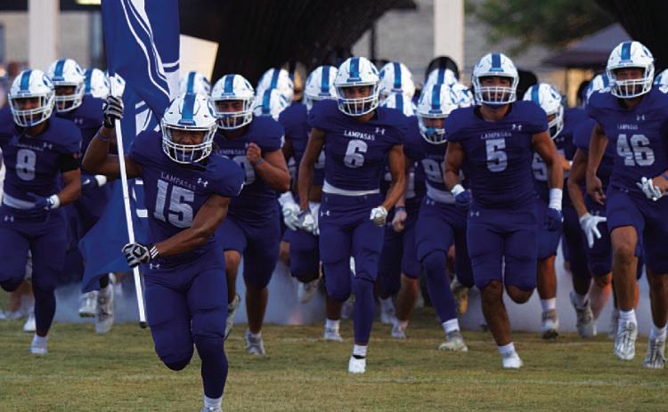 The Badgers break out of the tunnel for their season-opener against Elgin last week. HUNTER KING | DISPATCH RECORD