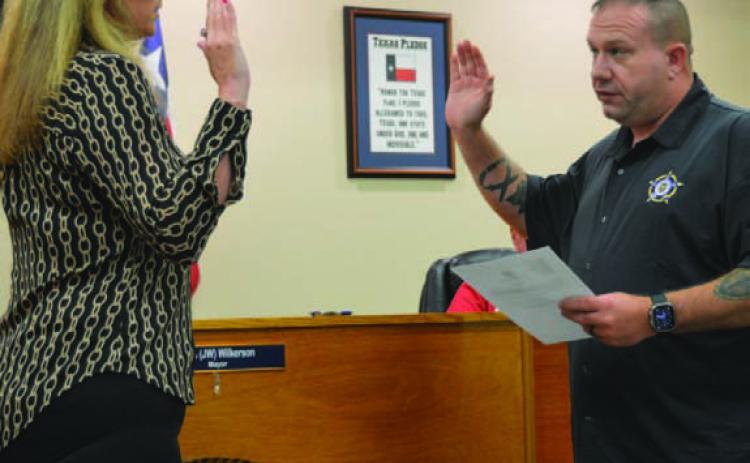 ERICK MITCHELL | DISPATCH RECORD At right, Kempner Mayor John Wilkerson administers the oath of office for new Court Clerk/Assistant City Secretary Rebecca Ramos. Kempner City Council members discussed staffing changes during Tuesday’s budget workshop.