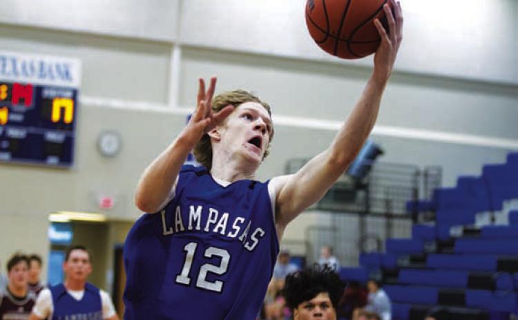 HUNTER KING | DISPATCH RECORD Peyton Sisson goes up to finish a layup during the scrimmages.