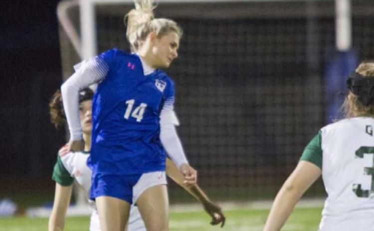 Tatum Linney (14) heads the ball in Tuesday’s home match. JEFF LOWE | DISPATCH RECORD
