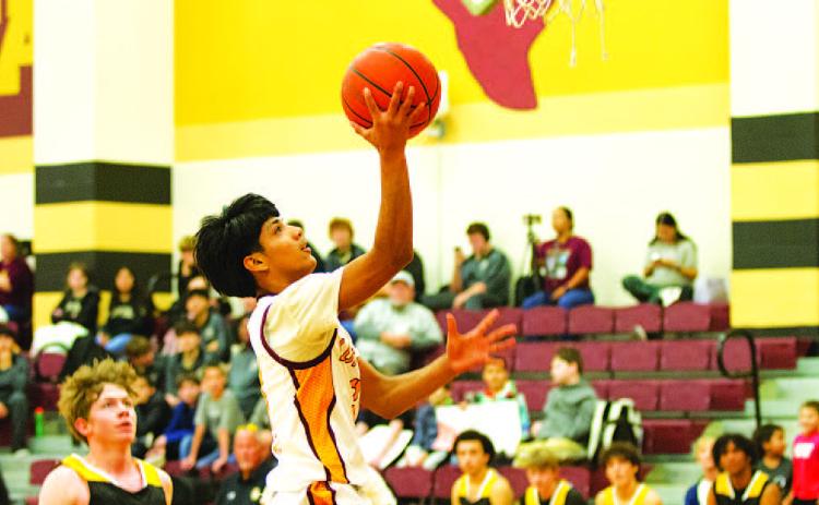 HUNTER KING | DISPATCH RECORD Pablo Carbajal goes up for a layup during the Hornets’ win over Santa Anna last Friday.
