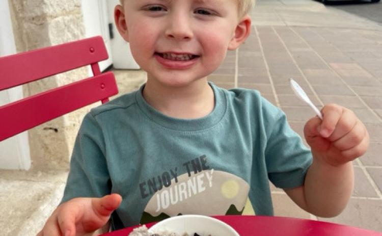 Two-year-old Briggs Perryman knows the best way to beat the summertime heat is with a big scoop of ice cream. Daytime highs remain around the century mark, with no rain predictions in sight. JOYCESARAH MCCABE | DISPATCH RECORD