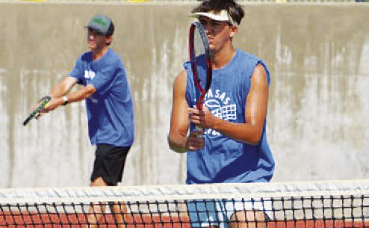 COURTESY PHOTO | KENNETH PEISER Tyler Ecker prepares to serve as Clyde Ashfield plays at the net.