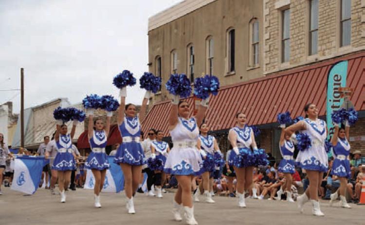 Lampasas cheerleaders dazzle spectators along Third Street during the Spring Ho Parade. ADAM BARRIOS | DISPATCH RECORD