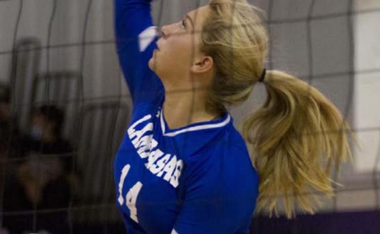 Madison Roedler goes up for a spike during the Lady Badgers’ match against Florence. HUNTER KING | DISPATCH RECORD