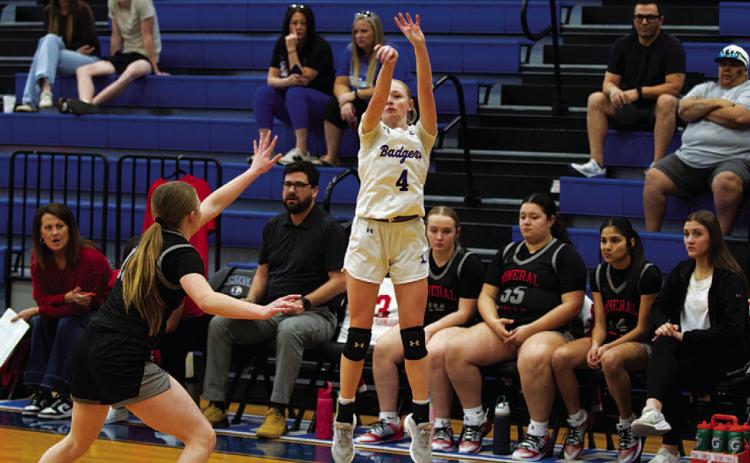 Adalya White shoots a three-point shot in an earlier game this season. HUNTER KING | DISPATCH RECORD