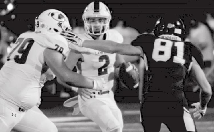 Ace Whitehead (2) keeps a play alive in the pocket as John Long (79) blocks against Stephenville. JEFF LOWE | DISPATCH RECORD