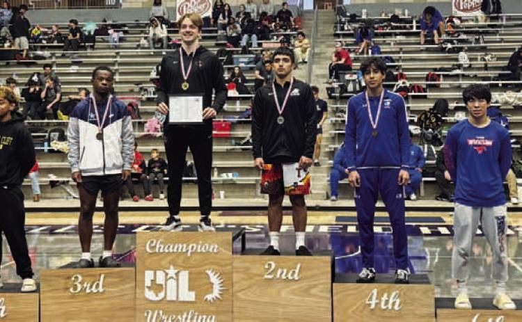 Kaiden Fernandez stands atop the podium at the regional wrestling tournament. COURTESY PHOTO