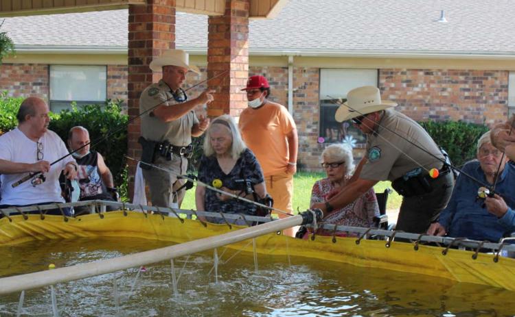 Nursing home holds early Father’s Day celebration with fishing event