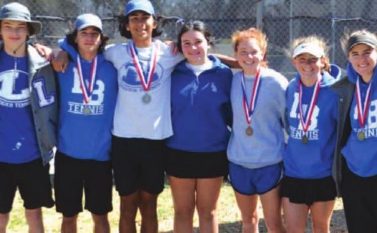 The tennis players pose for a photo with their medals after competing at district. COURTESY PHOTO