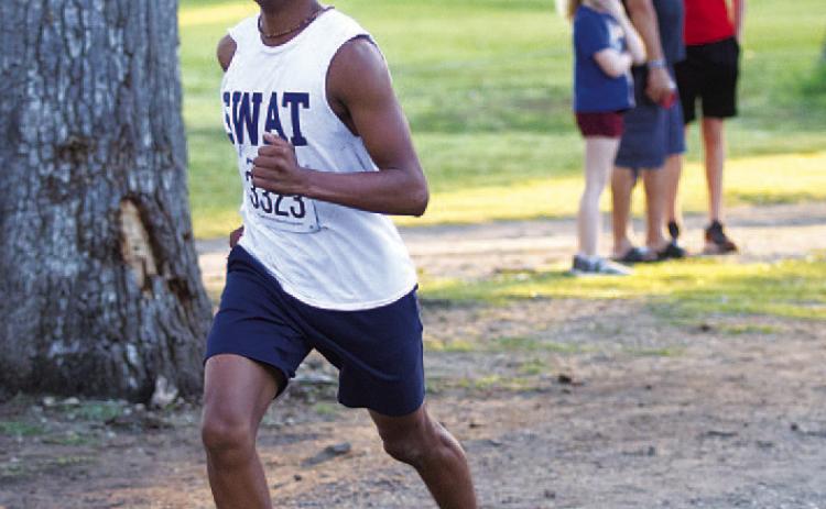 HUNTER KING | DISPATCH RECORD Zimri Vergara was the first-place finisher in the 1-mile race on Saturday.