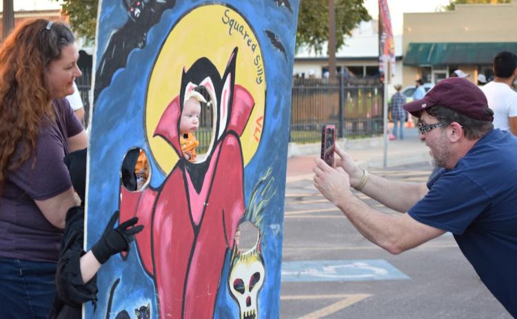 A family enjoys the festivities on the Lampasas courthouse square during the 2021 Squared Silly. FILE PHOTO