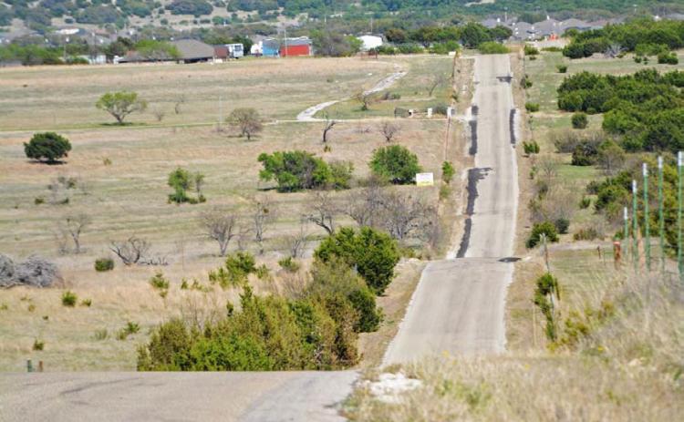COURTESY PHOTO Portions of County Road 3300 lie in both Precinct 4 and Precinct 1, and it is the most heavily traveled road in Precinct 1, Commissioner Bobby Carroll said.