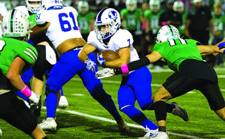 HUNTER KING | DISPATCH RECORD Daemian Rivas runs through a hole in the Burnet defense. He will need to be a factor in tonight’s game as well.