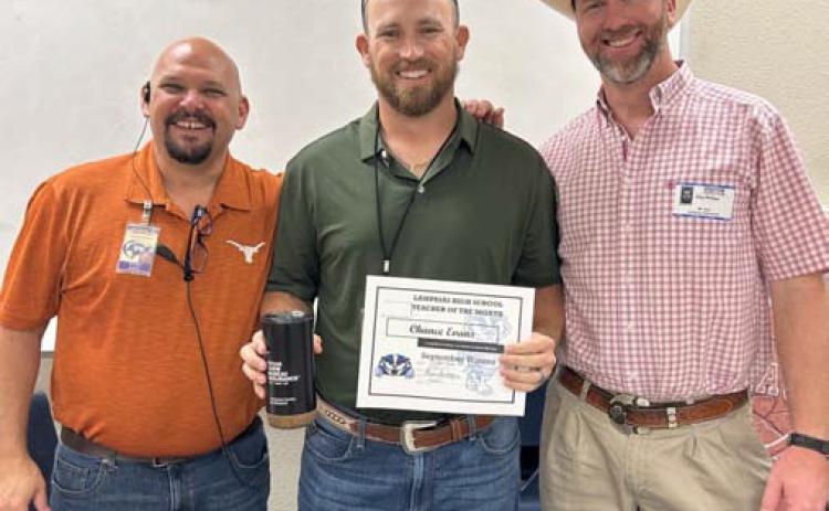 Chance Evans (center), a Lampasas High School head varsity baseball coach and career and technical education teacher, was named the campus’ September Teacher of the Month. Assistant Principal Ryan Race (left) credited Evans for his strong relationship with students. Texas Farm Bureau Insurance’s Clay Phillips also was on hand to recognize Davis. COURTESY PHOTO