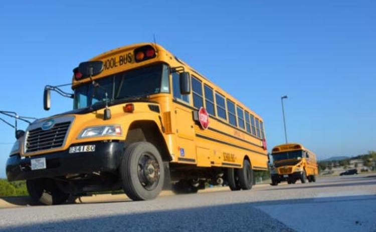 In this file photo school buses were lined outside of Taylor Creek Elementary on the first day of school. MONIQUE BRAND | DISPATCH RECORD