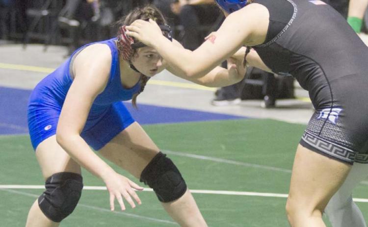 Mia Martell, left, wrestles against a Burleson Centennial Lady Spartan on Friday at the state tournament in Cypress. JEFF LOWE | DISPATCH RECORD