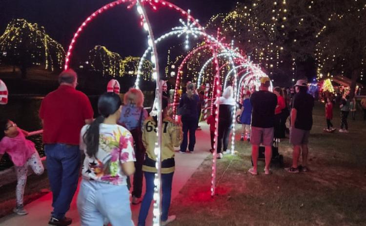 Throngs of Lampasans strolled through Candy Cane Lane at W.M. Brook Park on Saturday to view the holiday lights and festive decorations set up to celebrate the Christmas season. The Christmas on the Creek event offered rides on the Candy Cane Express, a visit with Santa and Mrs. Claus, and a stroll through the North Pole Village while sipping on hot chocolate. The special lights display will be available in the park through the New Year’s holiday. DAVID LOWE | DISPATCH RECORD