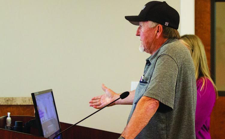 Businessman Deorald Finney offers information to the Lampasas City Council on his proposed four-story hotel, restaurant and retail center. HUNTER KING | DISPATCH RECORD