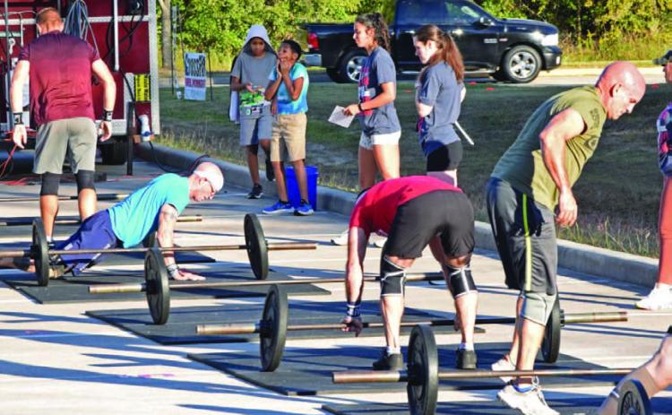 ALEXANDRIA RANDOLPH | DISPATCH RECORD Group workouts, even in organized settings like this east Houston competition, encourage rapport, healthy competitiveness and accountability.