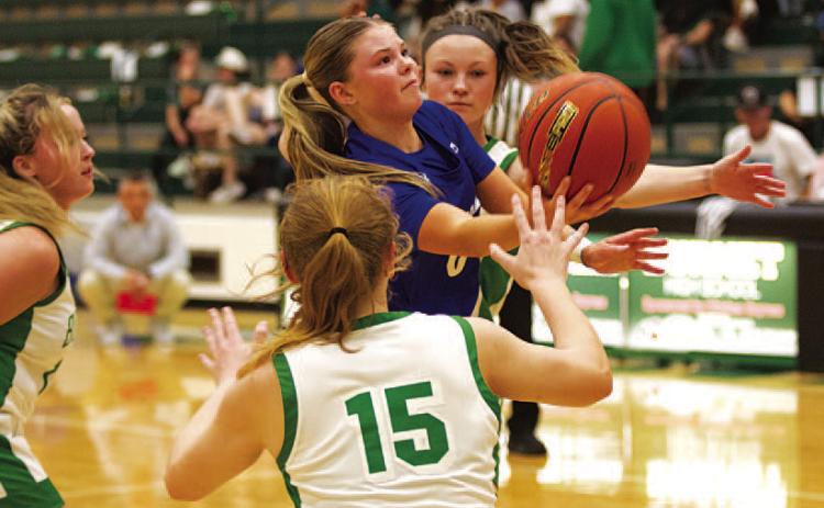 HUNTER KING | DISPATCH RECORD Addison Borchardt fights through contact to try and make a layup.