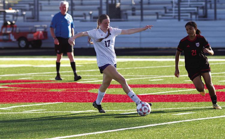HUNTER KING | DISPATCH RECORD Kari Kepler intercepts a pass during the Lady Badgers’ playoff match.