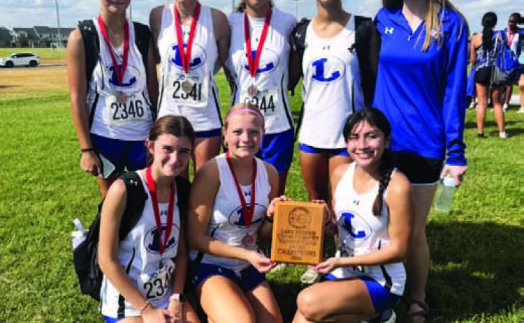 COURTESY PHOTO Lampasas’ girls’ cross country team finished in first place at the Bronco Invitational, hosted by Lake Belton. Hadlee McCorkle earned a first-place finish individually.