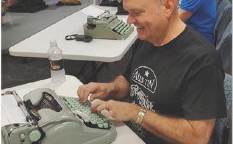 Local pastor Rick Willis has connected with other typewriter enthusiasts through social media. He is part of a diverse Facebook group called Austin Typewriter Ink and has participated in “type-in” events as pictured here. COURTESY PHOTO
