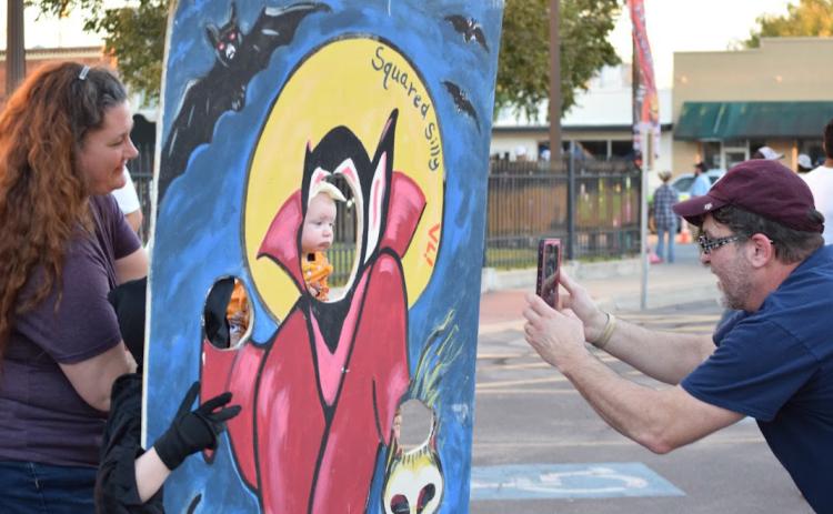 At a recent Squared Silly, participants could take photos using Halloween cutouts such as this. A variety of activities will be offered on the downtown square this year. FILE PHOTO