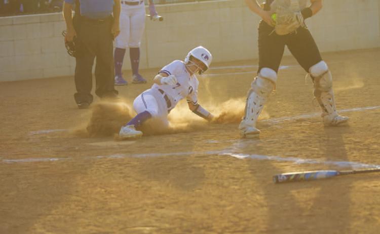 Maylee Kates slides into home plate during the first inning of the Lady Badgers’ game against Jarrell on Tuesday. HUNTER KING | DISPATCH RECORD