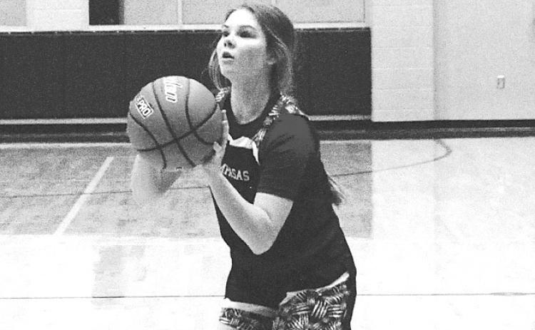 Addison Borchardt sets to release a three-point shot. HUNTER KING | DISPATCH RECORD