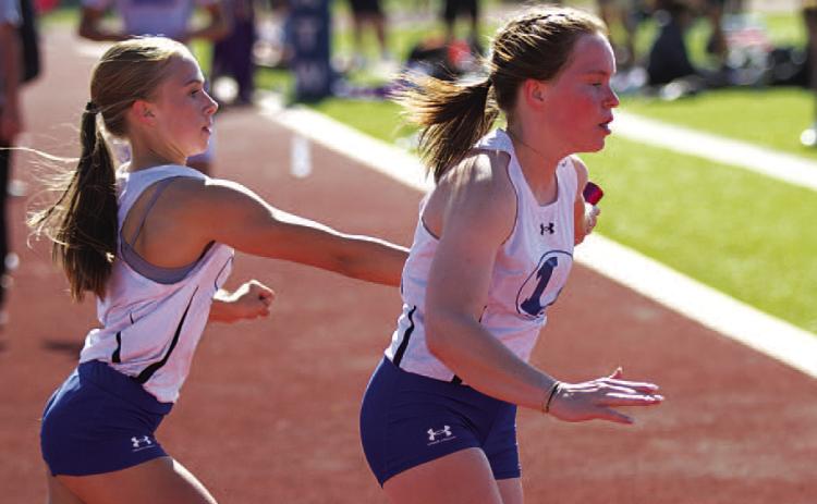 Aimee Weinheimer, left, and Lola Patterson ran in the 4x400-meter relay at the regional tournament. FILE PHOTO